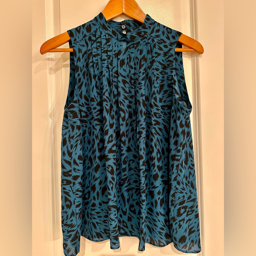 Beautiful royal blue animal print sleeveless blouse.